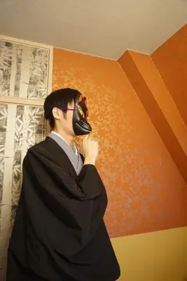 a man wearing a mask in a room at WA NO YADO-Asakusa Retreat 10 min walk from Asakusa Designer curated stylish room 4 in Tokyo