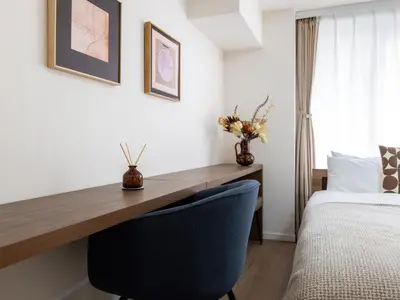 a bedroom with a desk and a bed at RARE-EBISU BREEZE Apartment in Tokyo