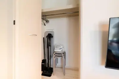 a stool sits in the corner of a room at Cheerful Kanegafuchi in Tokyo