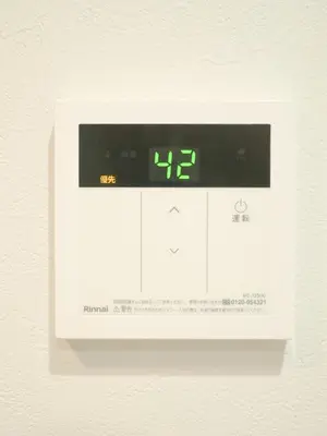 a digital clock on the wall with the time at 9Stay\u4e0a\u91ce\u5165\u8c37 in Tokyo