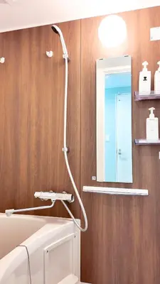 a bathroom with a shower and a sink and a mirror at 9Stay\u4e0a\u91ce\u5165\u8c37 in Tokyo