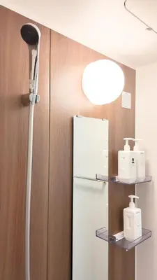 a floor lamp next to a refrigerator in a room at 9Stay\u4e0a\u91ce\u5165\u8c37 in Tokyo