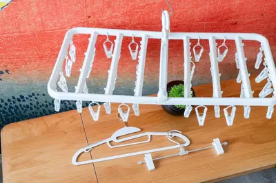 a rack of utensils hanging from a wall at Cheerful Takadanobaba in Tokyo