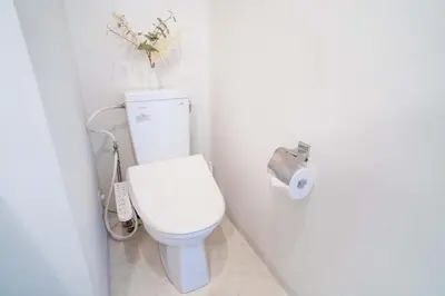 a bathroom with a white toilet with a roll of toilet paper at 202Room, 5 mins walk from JR Kinshicho North Exit!Near Asakusa & Sky Tree!! The house is on the 2th floor with an elevator, convenient transportation There is a balcony and the room is soundproofed in Tokyo
