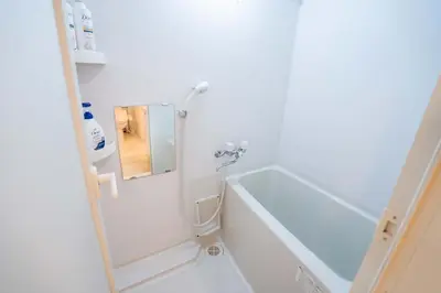 a bathroom with a shower and a bath tub at 202Room, 5 mins walk from JR Kinshicho North Exit!Near Asakusa & Sky Tree!! The house is on the 2th floor with an elevator, convenient transportation There is a balcony and the room is soundproofed in Tokyo