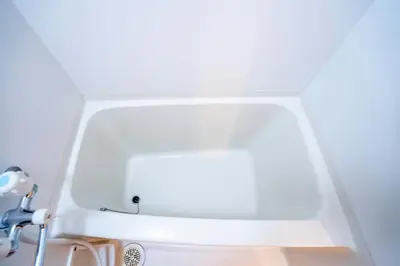 a white sink in a bathroom with aaucet at 202Room, 5 mins walk from JR Kinshicho North Exit!Near Asakusa & Sky Tree!! The house is on the 2th floor with an elevator, convenient transportation There is a balcony and the room is soundproofed in Tokyo