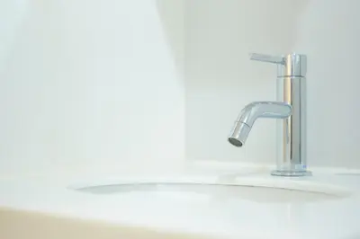 a sink with a faucet in a bathroom at Tierra Mukojima in Tokyo