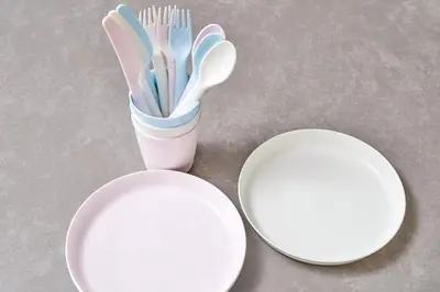 two white plates with toothbrushes in a holder on a table at Hatagaya Hotel in Tokyo