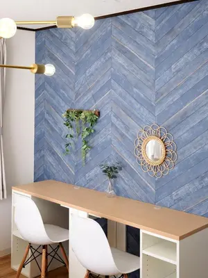 a dining room with a blue tiled wall at Hatagaya Hotel in Tokyo