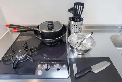 a stove top with a pot on top of it at monthly Oakville \u6839\u6d25 in Tokyo