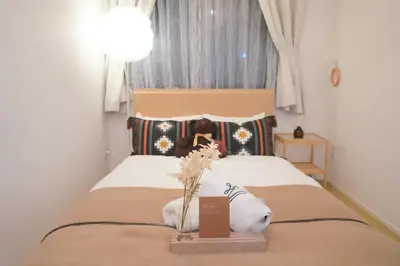 a room with a bed with a sign on it at Skytree Garden Hotel in Tokyo