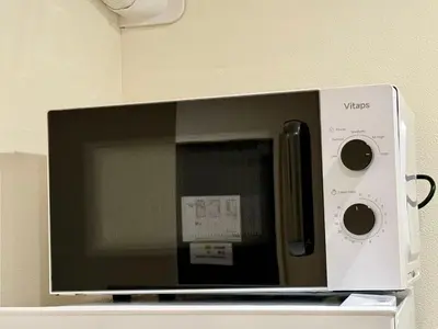 a microwave oven sitting on top of a shelf at Yt \u30af\u30ea\u30b9\u30bf\u30eb\u4e09\u7b4b in Tokyo