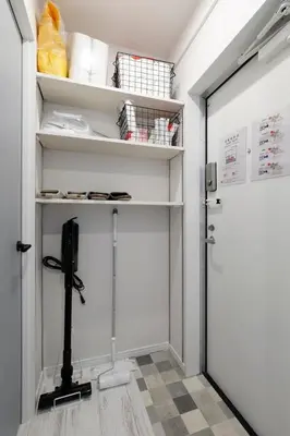 a walk in closet with a door and shelves at Excellent Arbre in Tokyo