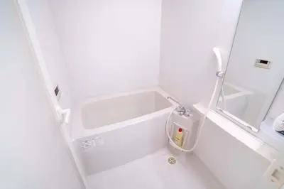 a small bathroom with white walls and white floors at 504Room Kinshicho Station 5 min walk near Asakusa and Skytree 5th floor with balcony and good soundproofing in Tokyo