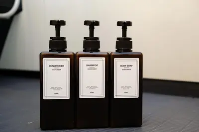 two bottles of soap sitting next to each other at Stellar inn - \u65e9\u7a32\u7530\u99c5\u304b\u3089\u5f92\u6b693\u5206- \u6700\u59277\u540d\u5bbf\u6cca\u53ef in Tokyo