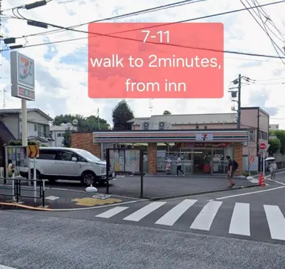 a sign that reads walk to minutes from inn at nishiotiai,shinjukustation12 minutes by train in Tokyo