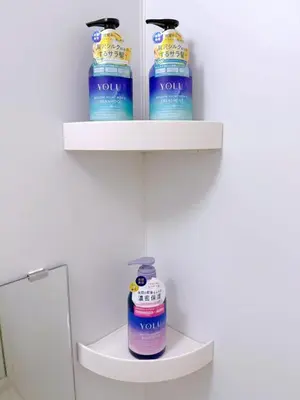 a shelf with four bottles of toiletries in a bathroom at Cute Anime-Style Room Near Kinshicho Station in Tokyo