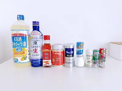 a row of bottles and cans sitting on a counter at Cute Anime-Style Room Near Kinshicho Station in Tokyo