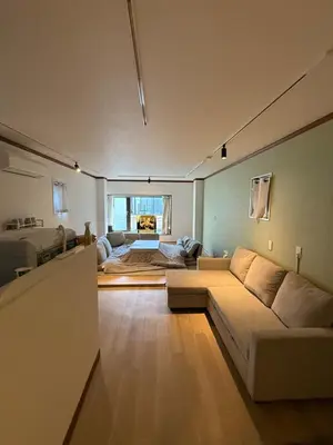a living room with a couch and a bed at Villa TOKYO SHIMOTAKAIDO Nest in Tokyo