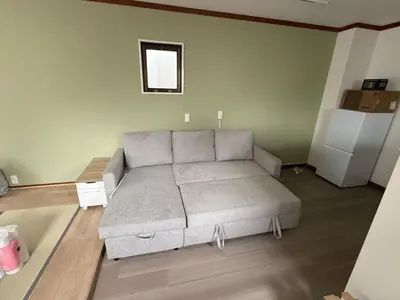 a living room with a couch in a room at Villa TOKYO SHIMOTAKAIDO Nest in Tokyo