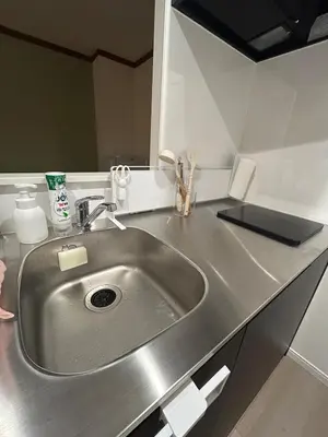 a kitchen counter with a stainless steel sink at Villa TOKYO SHIMOTAKAIDO Nest in Tokyo