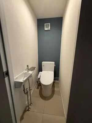 a small bathroom with a toilet and a sink at Villa TOKYO SHIMOTAKAIDO Nest in Tokyo