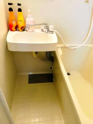 a bathroom sink with three cleaning bottles on it at \u30e9\u30a4\u30aa\u30f3\u30ba\u30d7\u30e9\u30b6\u65b0\u5bbf901 in Tokyo