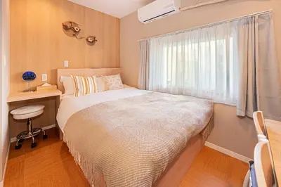 a small bedroom with a bed and a window at Komorebi Asakusa Cozy 6P Stay The 77 House Tokyo in Tokyo