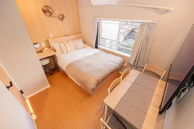 a small bedroom with a bed and a window at Komorebi Asakusa Cozy 6P Stay The 77 House Tokyo in Tokyo