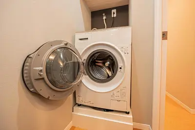 a washer and dryer in a laundry room at Komorebi Asakusa Cozy 6P Stay The 77 House Tokyo in Tokyo