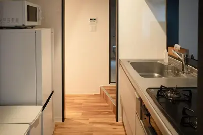 a kitchen with a sink and a refrigerator at Takinogawa-1ldk\u677f\u6865 KI0429 in Tokyo