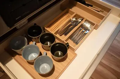 a group of pots and pans sitting on a kitchen counter at Takinogawa-1ldk\u677f\u6865 KI0429 in Tokyo