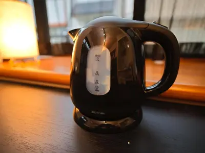 a black coffee cup sitting on a table at The Nest Koenji Cozy Stay near Station Easy Access to Shinjuku in Tokyo