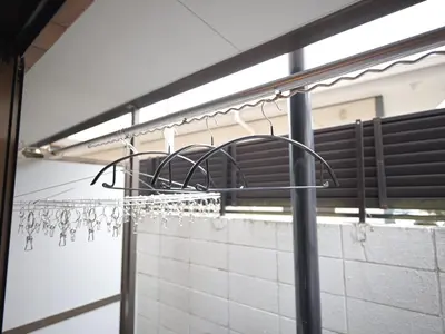 a bunch of wine glasses hanging on a rack at The Nest Koenji Cozy Stay near Station Easy Access to Shinjuku in Tokyo