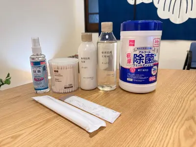 a table with bottles of milk and a knife on it at En House Asakusa in Tokyo
