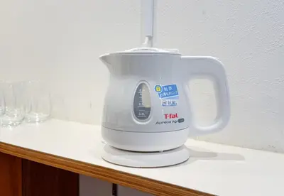 a white mixer sitting on a counter top at Great location 8 minutes on foot from Higashi-Shinjuku Station and 1 stop from Shinjuku Station! Accommodates up to 11 people Wi-Fi available Shibuya, Asakusa, Ikebukuro in Tokyo