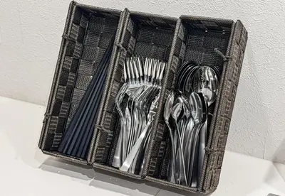 a basket of utensils sitting on top of a table at Great location 8 minutes on foot from Higashi-Shinjuku Station and 1 stop from Shinjuku Station! Accommodates up to 11 people Wi-Fi available Shibuya, Asakusa, Ikebukuro in Tokyo