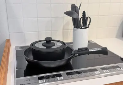 a pot sitting on top of a stove at Great location 8 minutes on foot from Higashi-Shinjuku Station and 1 stop from Shinjuku Station! Accommodates up to 11 people Wi-Fi available Shibuya, Asakusa, Ikebukuro in Tokyo