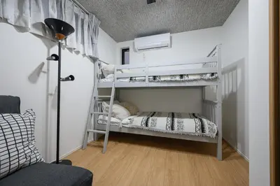 a bedroom with two bunk beds in a room at Skytree View Riverside Terrace in Tokyo