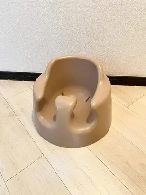 a brown object sitting on a wooden floor at INDIGO HOUSE 3-story House, 4BR 8 Beds, Family Friends Welcome - Shinjuku Disney\u6771\u4eac\u30c7\u30a3\u30ba\u30cb\u30fc\u30ea\u30be\u30fc\u30c8 in Tokyo