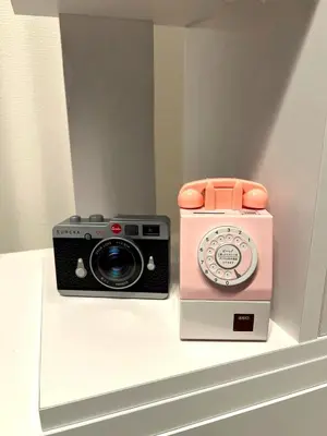a camera and a radio sitting on a shelf at Private Yotsugi Prime Direct Access from Haneda & Narita Airports in Tokyo
