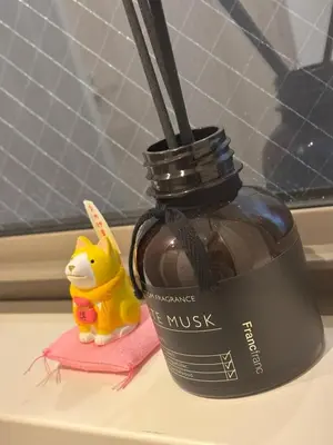 a bottle of honey sitting on a window sill at Private Yotsugi Prime Direct Access from Haneda & Narita Airports in Tokyo