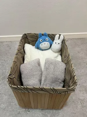 two stuffed animals sitting in a basket with towels at Private Yotsugi Prime Direct Access from Haneda & Narita Airports in Tokyo