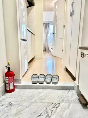 a room with three dog bowls on the floor at Room with a view of Skytree, close to Kinshicho station in Tokyo