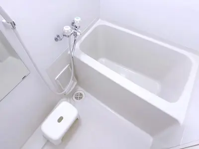 a white bathroom with a shower and a sink at Room with a view of Skytree, close to Kinshicho station in Tokyo