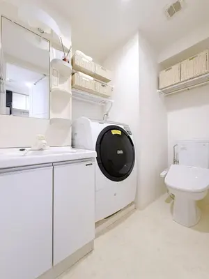 a washing machine in a bathroom with a toilet at Room with a view of Skytree, close to Kinshicho station in Tokyo