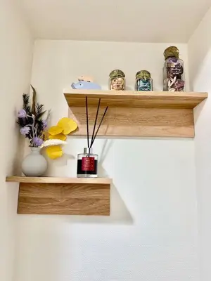 a room with wooden shelves with vases and flowers at Room with a view of Skytree, close to Kinshicho station in Tokyo