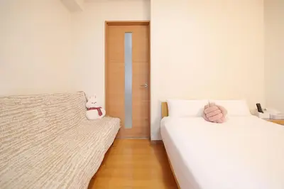 a bedroom with two beds with stuffed animals on them at 3 min JR Near Tokyo Skytree Asakusa Shinjuku Sea Heim in Tokyo