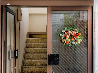 a door of a building with a wreath on it at 3 min JR Near Tokyo Skytree Asakusa Shinjuku Sea Heim in Tokyo
