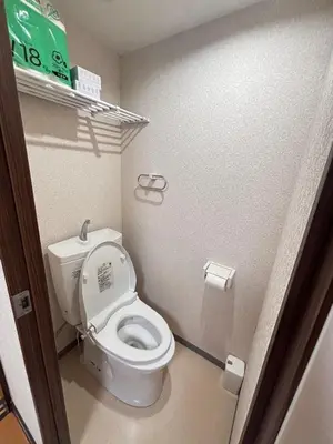 a bathroom with a white toilet in a stall at 3 min JR Near Tokyo Skytree Asakusa Shinjuku Sea Heim in Tokyo